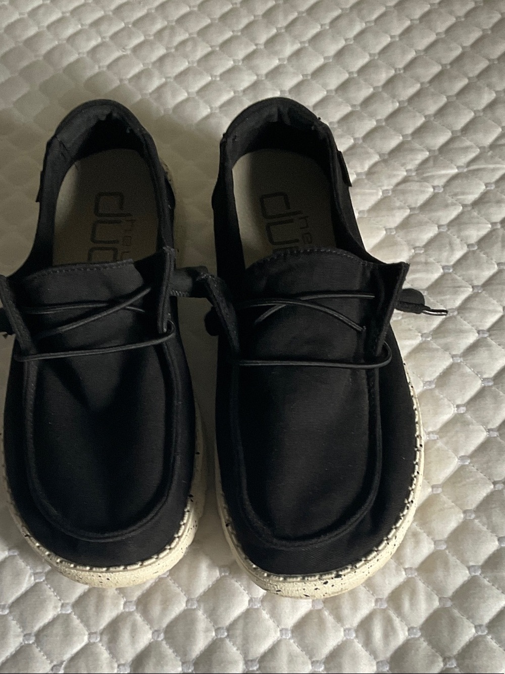 Hey Dude Black Slip-On Sneakers with White Speckled Sole